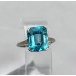 A white metal dress ring set rectangular cushion cut blue zircon, stamped '18 ct plat', 4.5 gm