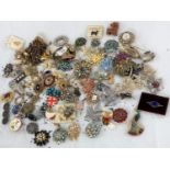 A selection of vintage and later costume jewellery, mainly brooches (please note some items may have