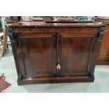 A 19th century rosewood side cabinet with square reeded acanthus carved side columns and 2 panel