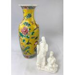 A Chinese baluster vase with intricate enamel famille jaune decoration of birds, flowers and foliage