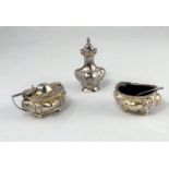 A Georgian style 3 piece hallmarked silver cruet of rounded rectangular form, with lobed and