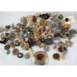 A selection of vintage and later costume jewellery, mainly brooches (please note some items may have