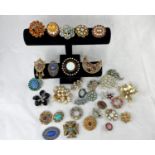 A selection of decorative costume brooches set multi-coloured stones, from the mid 20th century