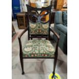 A mahogany Art Nouveau armchair upholstered in a William Morris print