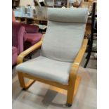 A modern Ikea arm chair in lightwood and cream fabric