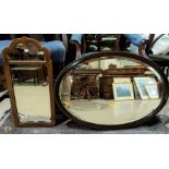 A 19th century wall mirror in mahogany and parcel gilt frame; a similar oval mirror