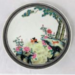 A Chinese Republic period plaque decorated with birds, etc., in the famille rose manner, diameter 24