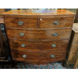 A Georgian mahogany bow front chest of 3 long and 2 short drawers with brass oval drop handles, on