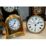 A 19th century bedside clock in circular brass case, with white enamel dial and French drum