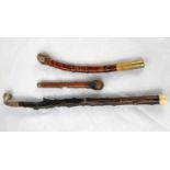 Three various Chinese wooden opium pipes with metal fittings