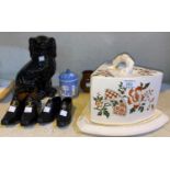 A Victorian large pottery cheese dish, height 20 cm; a Staffordshire black glazed dog other