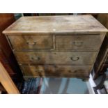 A 19th century stained wood chest with 2 long and 2 short drawers with brass swan neck handles, on