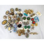 A selection of costume brooches and earrings