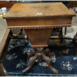 A walnut work table with marquetry inlay, having hinged rectangular top and fitted interior with