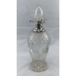 A cut decanter with hallmarked silver trefoil lipped collar