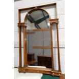 An overmantel mirror in architectural arch top frame, flanked by double columns, 112 x 71 cm