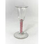 A Georgian style bell shaped wine glass with multiple pink and white opaque twist stem, height 16cm