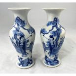 A 19th century Chinese pair of inverted baluster vases decorated in blue and white with female