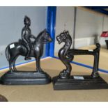 Two cast iron doorstops: horse and horse with rider