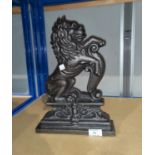 A large cast iron doorstop: lion rampant