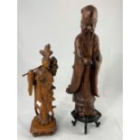 Two Chinese carved wooden figures, 1 of a male sage, the other a lady carrying flowers, 35cm and
