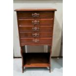 An Edwardian mahogany 5 height music cabinet with open shelf under