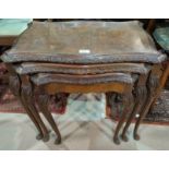 A carved walnut nest of 3 reproduction occasional tables