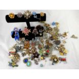 A selection of decorative costume jewellery, mainly brooches