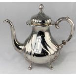 A Swedish silver coffee pot of spiral ribbed baluster form with flame finial and 4 feet, 3 crown