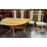 A modern Ercol light oak dining table with drop leaf and 4 chairs with carved wheat pattern