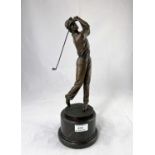 A modern bronze depicting a male golfer, on grey marble plinth, height 38