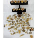 A selection of gilt costume jewellery, mainly brooches (please note some items may have stones