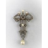 A 'Belle Epoque' diamond and pearl yellow and white metal brooch with central stem and twin scroll