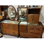 An Arts and Crafts style oak bedroom suite comprising dressing table 99cm, washstand 99cm and a