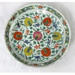 A Chinese famille verte charger decorated with flowers etc, bearing old metallic repairs, diameter