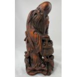 A Chinese carved bamboo figure of man with basket, height 25cm
