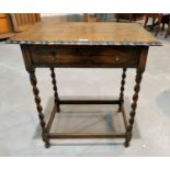 A 1930's oak occasional table with rectangular top, frieze drawer, on barley twist legs