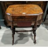 A Victorian figured walnut work/writing table with hinged rectangular shaped top, leather writing