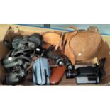 A selection of vintage cameras; binoculars; etc.
