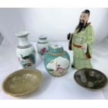 A Chinese porcelain figure of man in traditional dress, fingers af, height 30cm, a similar Chinese