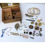 A selection of Victorian and later costume jewellery: bangles; lockets; brooches; etc.