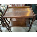 An oak tea trolley; a 19th century bed step/commode; a 1930's wall mirror in canted and beaded oak