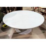 A 1960's white laminate 'tulip' coffee table with circular top on low cast metal column, flared