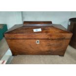 An early 19th century mahogany sarcophagus shaped tea caddy