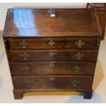 A Georgian crosshanded and inlaid fall front bureau with graduating drawers under, on bracket