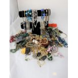 An unusual selection of costume jewellery including brooches, necklaces etc