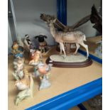 A resin deer and eagle; a selection of bisque animals and birds