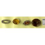 A Victorian brooch set oval amber coloured faceted stone; another brooch set amber coloured