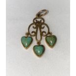 A yellow metal pendant with 3 heart shaped turquoise drops, unmarked tests as circa 18 ct, 2.5