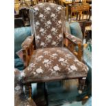 A Victorian armchair in embossed floral fabric with high back